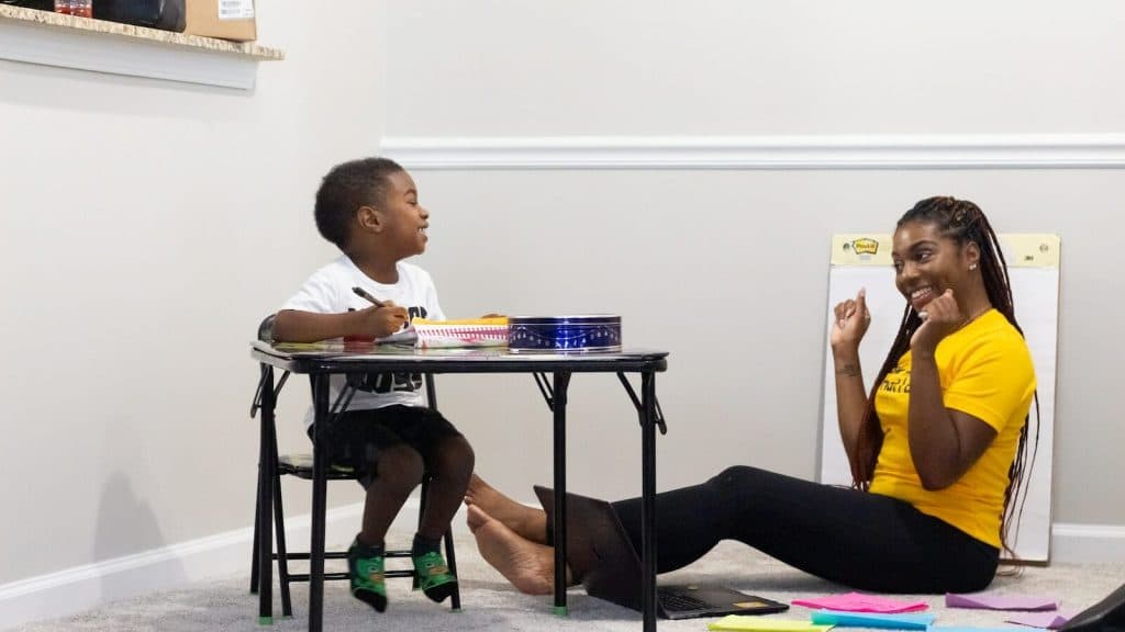woman in black dress sitting on chair