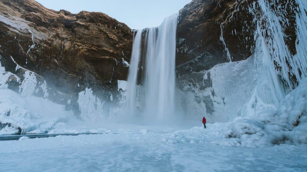 Person Walking on Snowfield